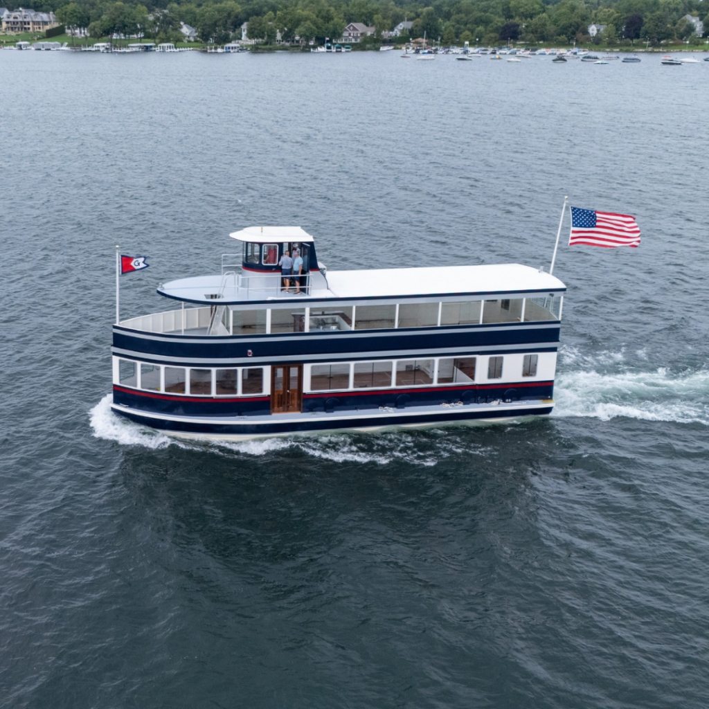 Majestic, the newest Lake Geneva Cruise Line boat, cruising the lake with an American flag